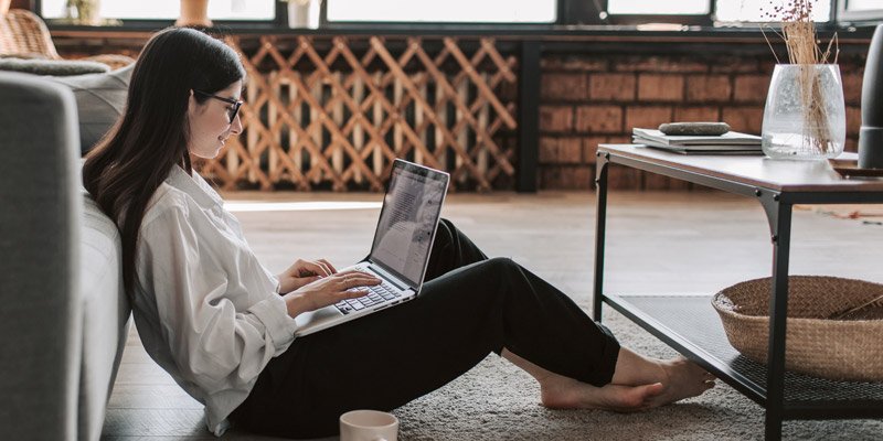 Woman sitting at computer taking panelbase surveys